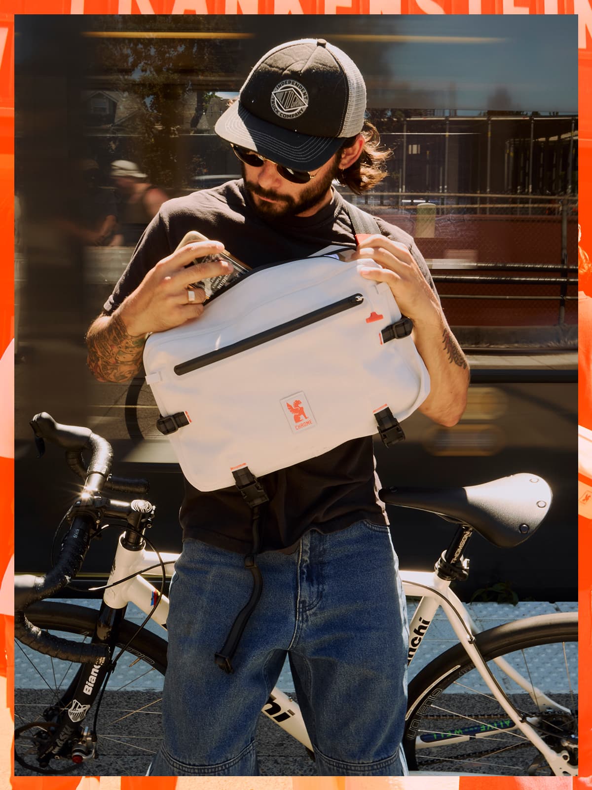 A guy putting his phone into the Kadet Max WP in white