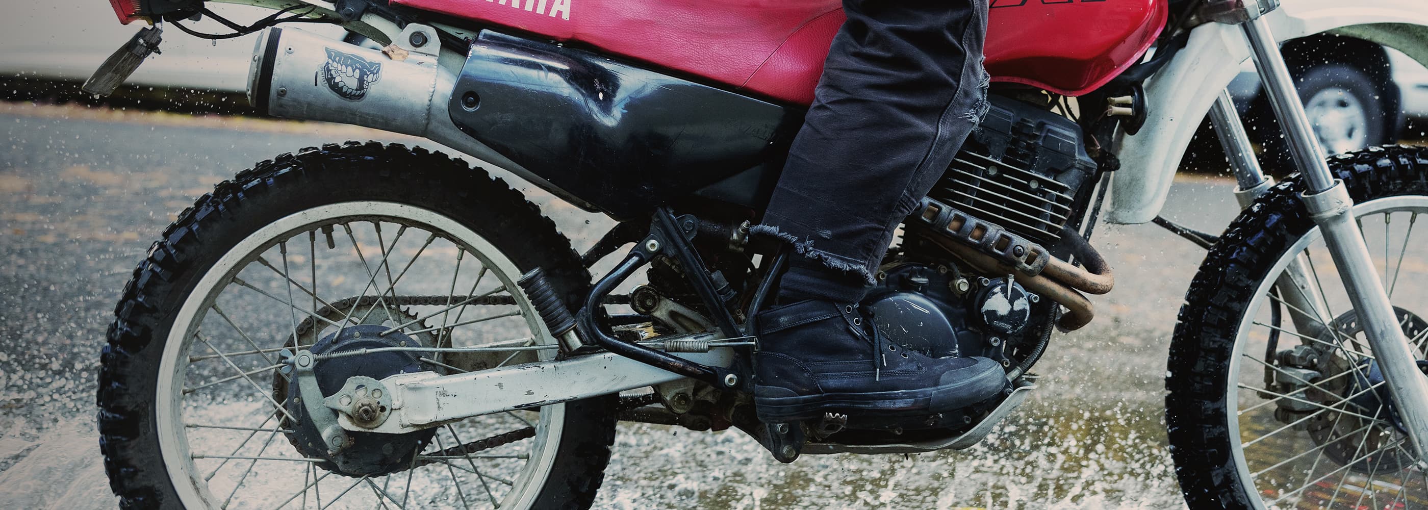 Person riding a motorcycle wearing Chrome Industries 415 Boots in black