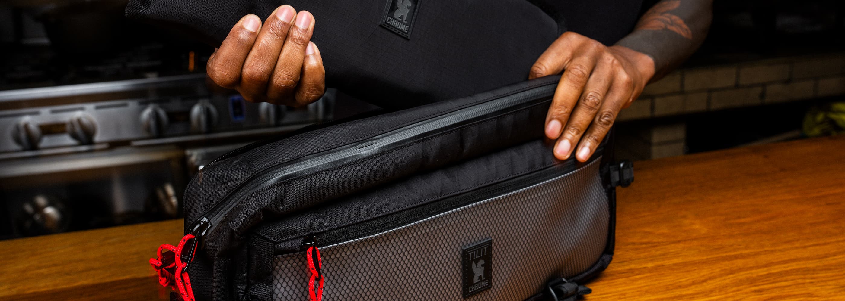 The Chrome x TILIT Chef Kadet with Knife roll being inserted