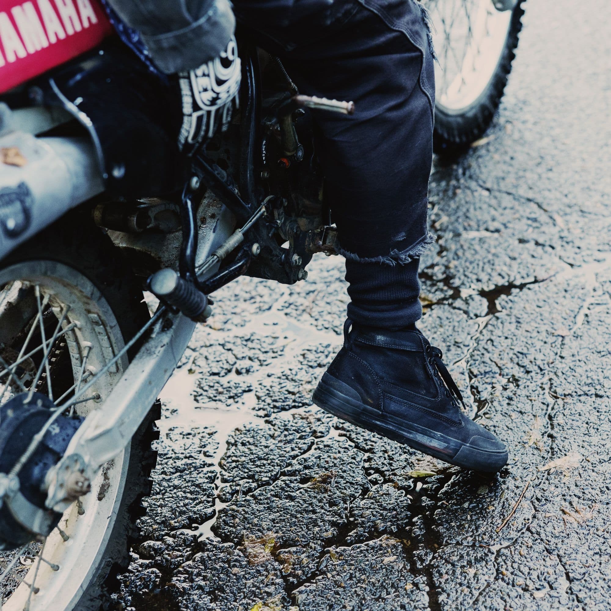 The 415 Boot in black on a person riding a motorcycle