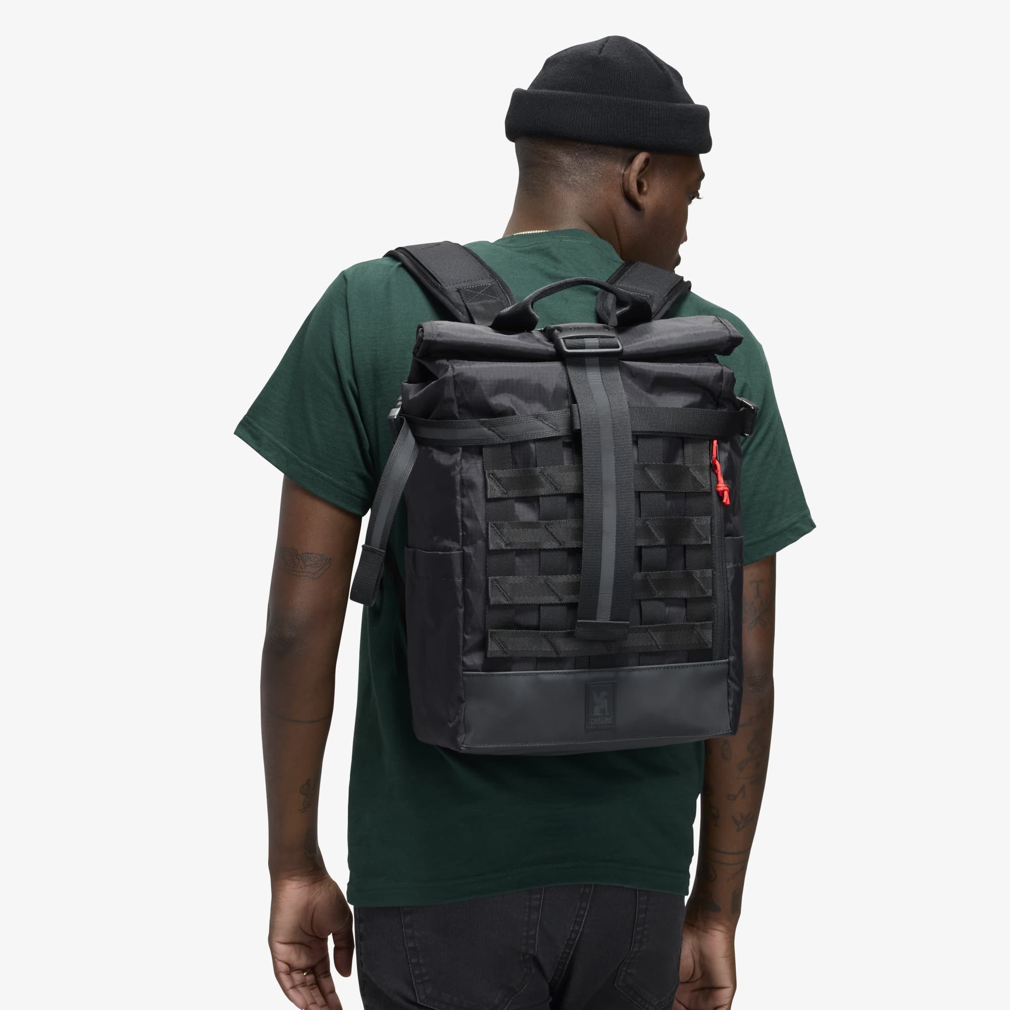 Barrage 18L Backpack on a man in reflective black #color_black xrf