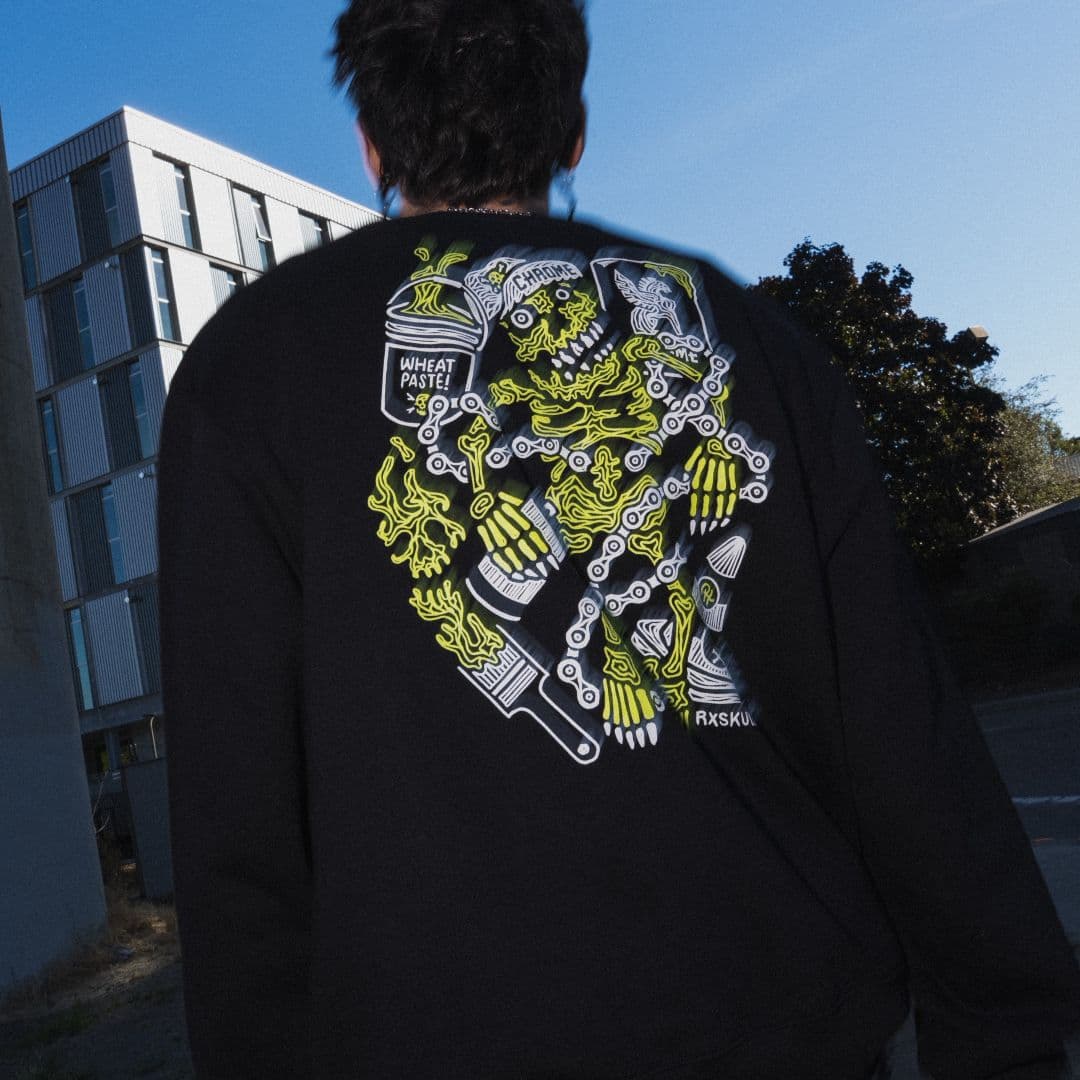 A guy wearing the Chrome x RxSkulls Sweatshirt