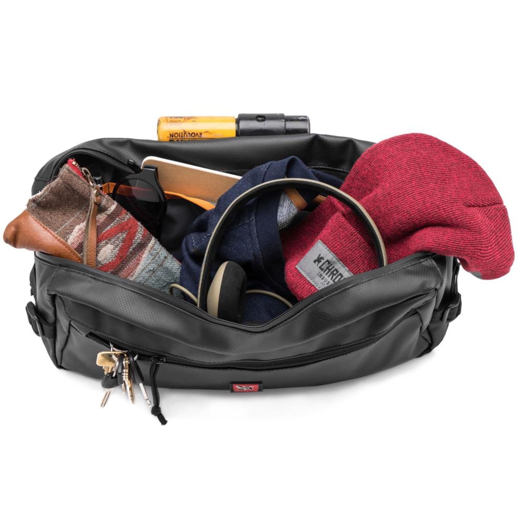 A hat, U-Lock and sunglasses inside a Kadet 9L Sling in black tarp #color_black tarp