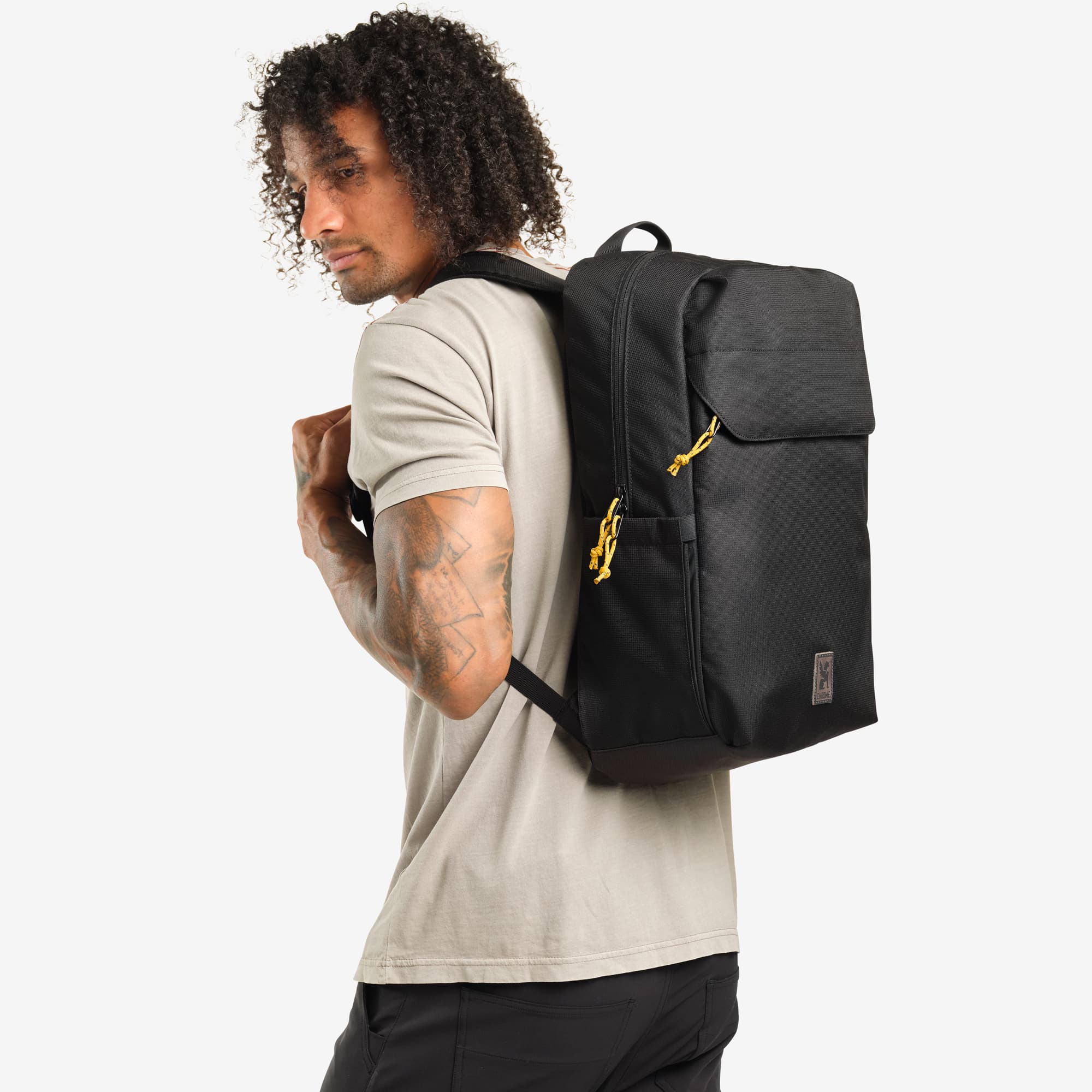 Ruckas Backpack in Black example for  royale color on a guy #color_royale