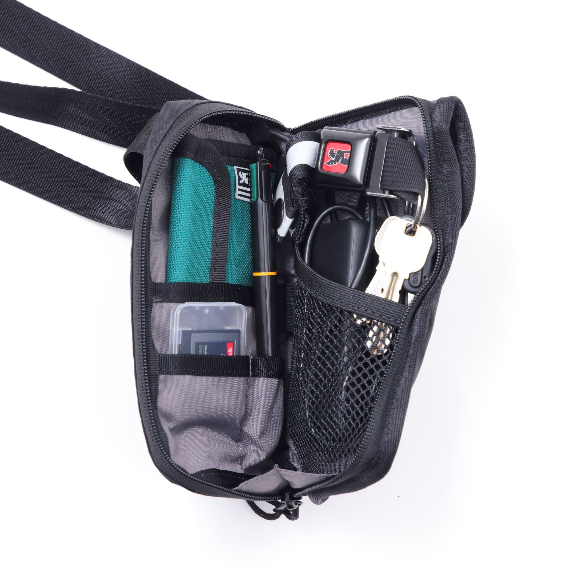 A packed out version of the Travel Tech Pouch in black