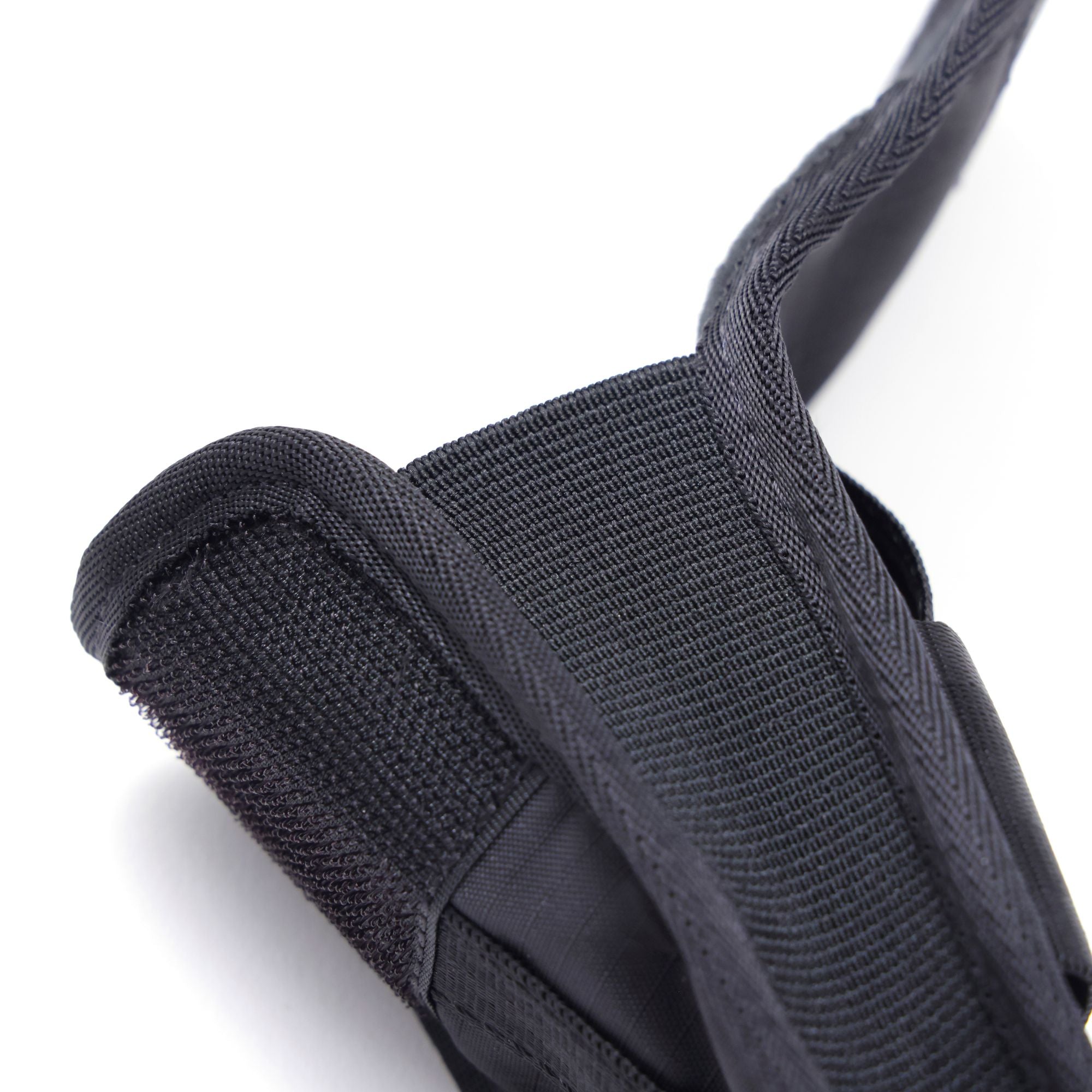 The side gusset of the Sunglass Pouch in black