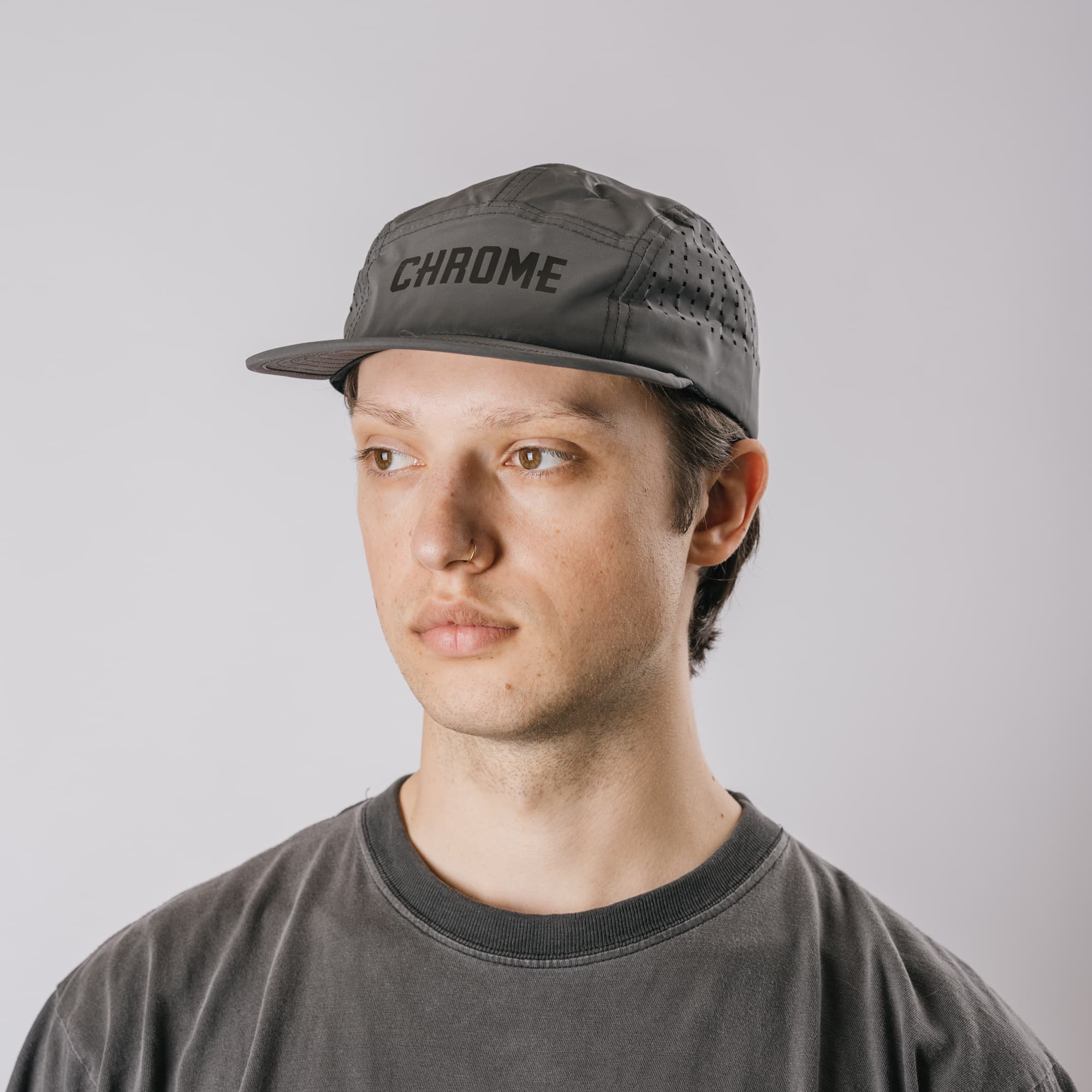 The front of the new Chrome Industries Five Panel Hat in black reflective