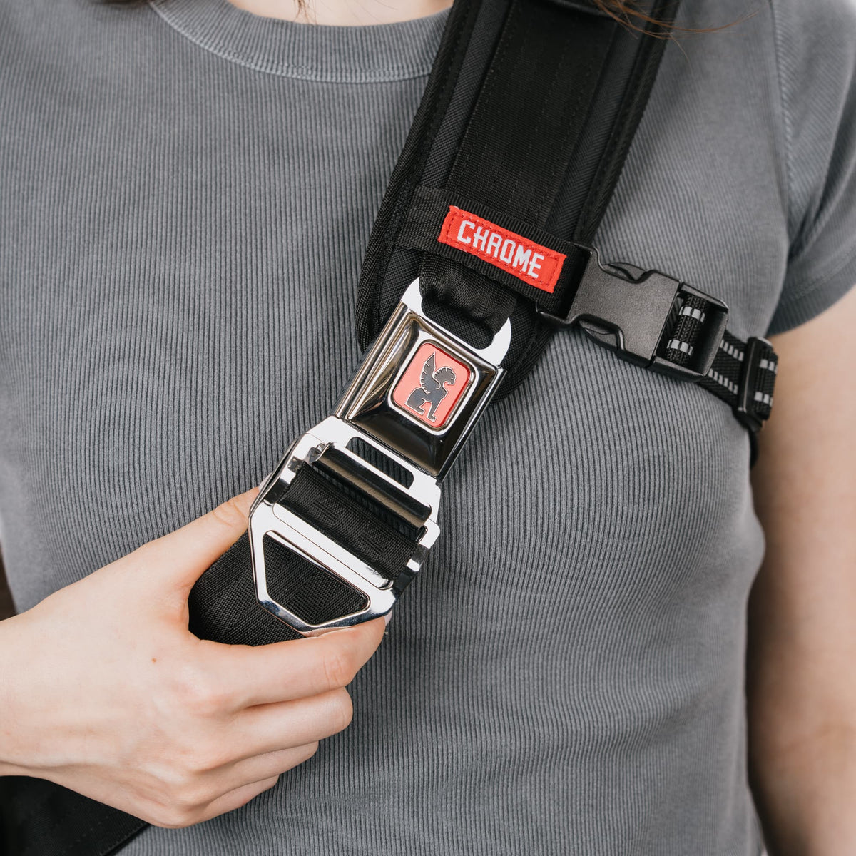 Up close of the buckle on the Kadet Max Sling in Classic Black White #color_classic / black / white