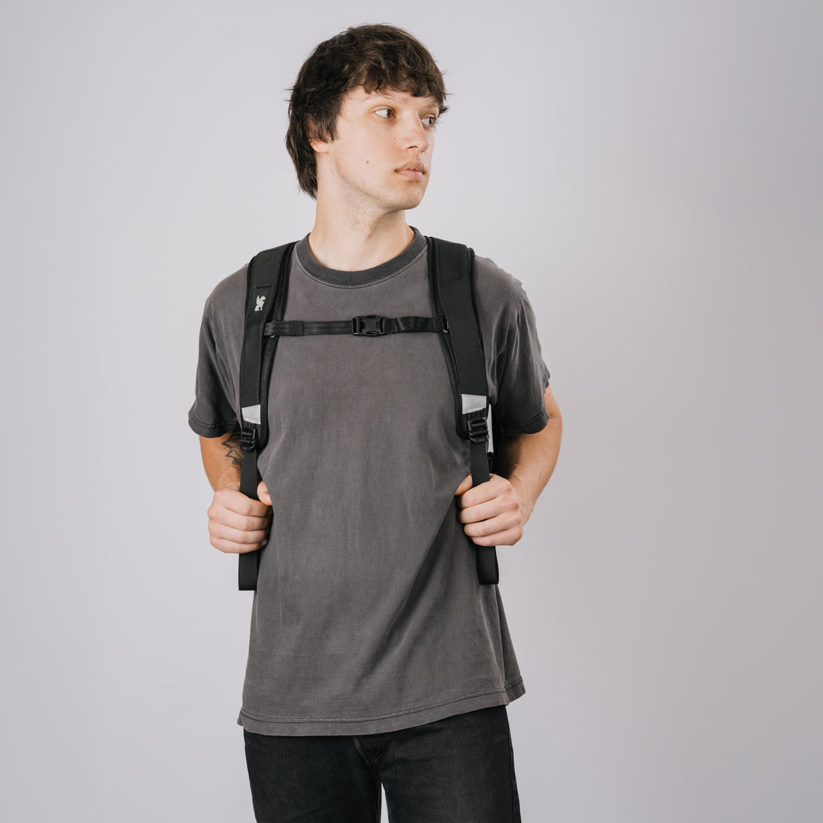 The Barrage 22L in new Classic Black White front view on a guy #color_classic / black / white