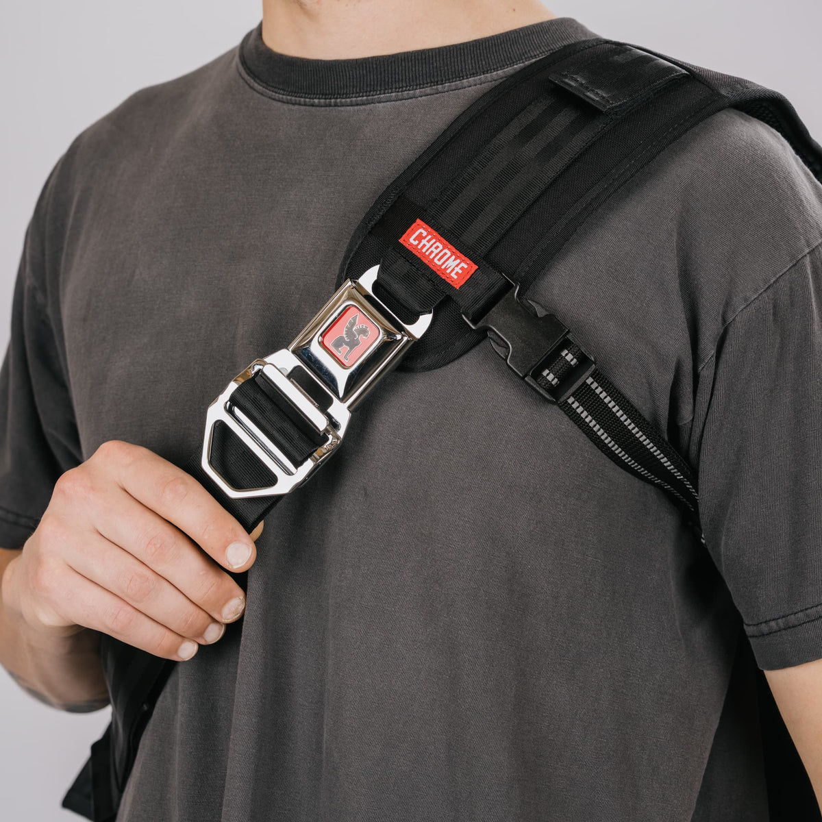 An up close of the buckle on the Citizen 24L Messenger in new Classic Black White #color_classic / black / white