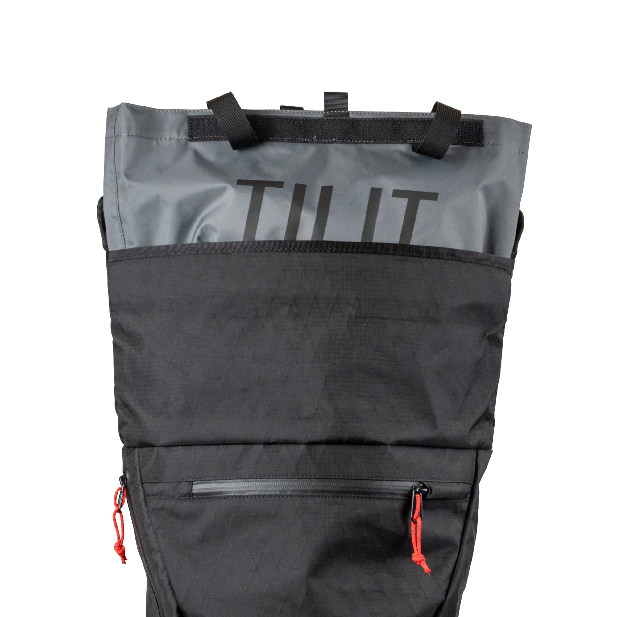 The tote coming out the top of the Chrome x Tilit 29L Chef Pack in black