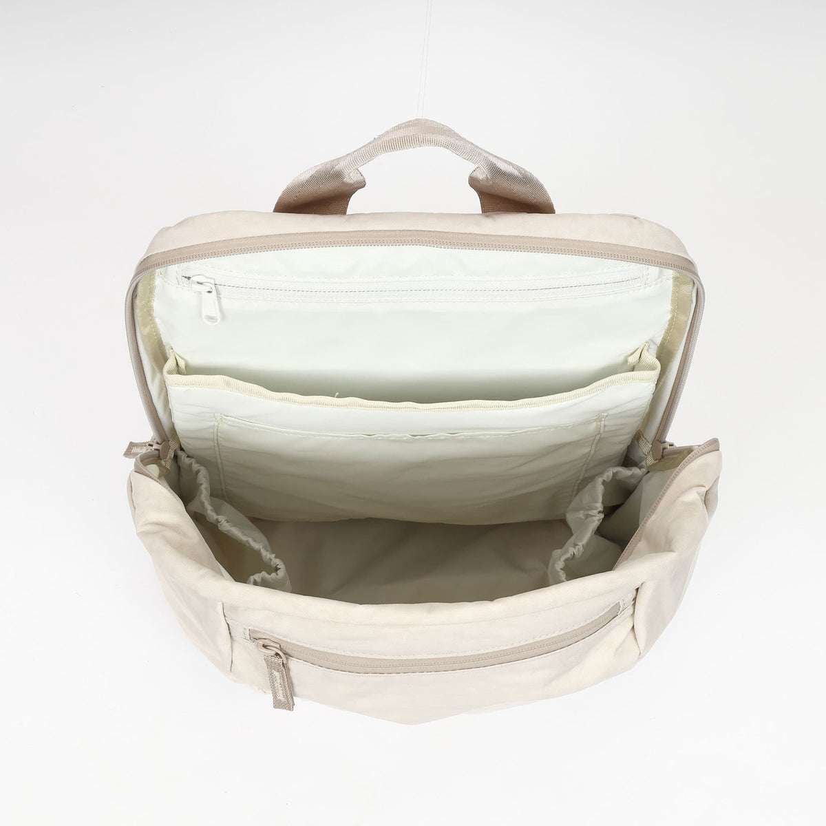 The inside of the new Grocery 22L Pack in Chalk #color_chalk