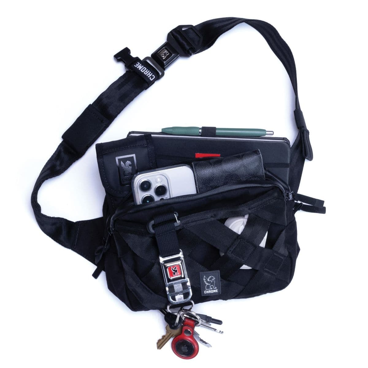 The barrage 5L packed out with phone, keys, wallet, sunglasses and a notebook