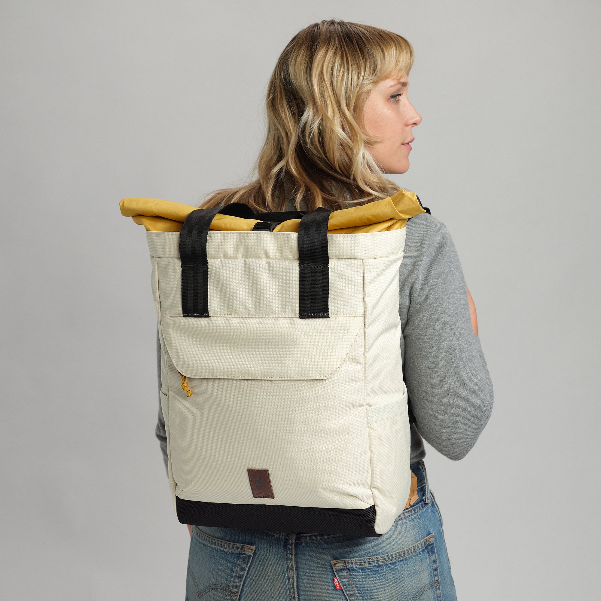 Ruckas tote in natural on a woman worn as a backpack