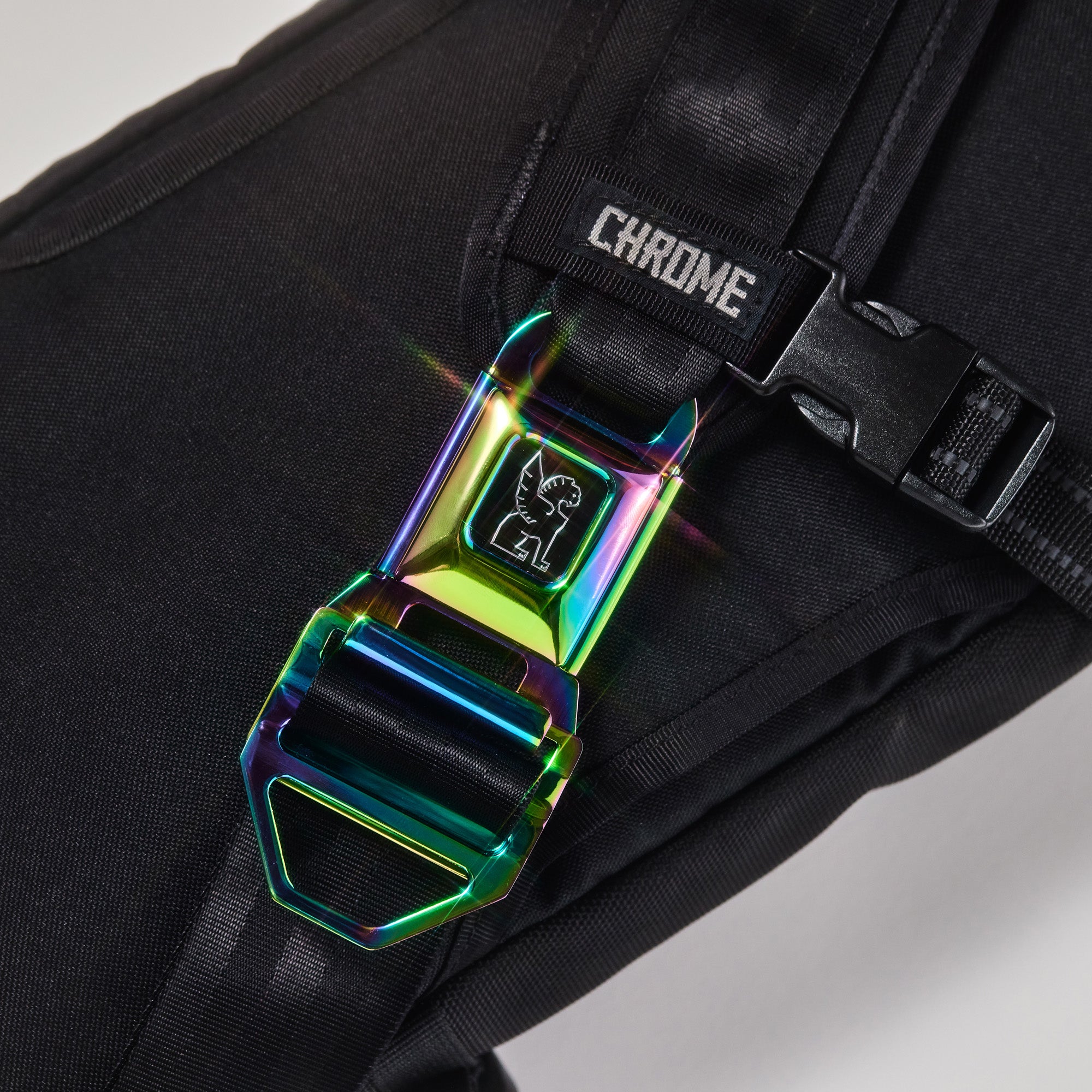 Chrome LG iconic buckle in rainbow shown on a Kadet #color_rainbow
