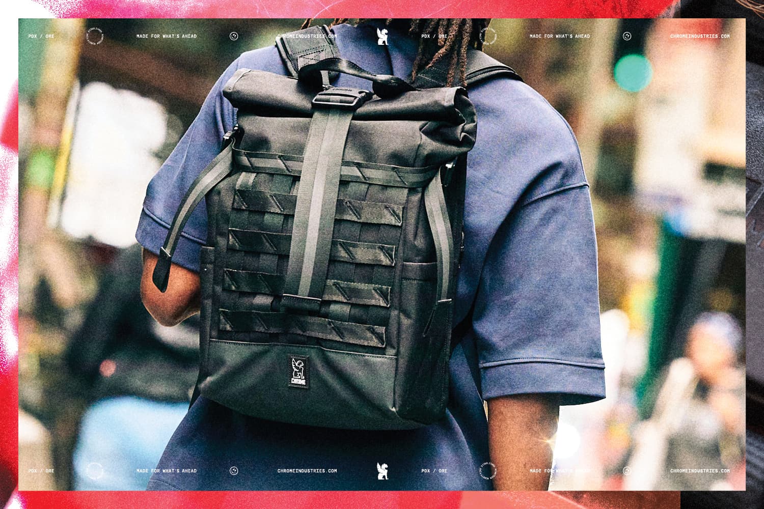 Man wearing the new black Barrage backpack
