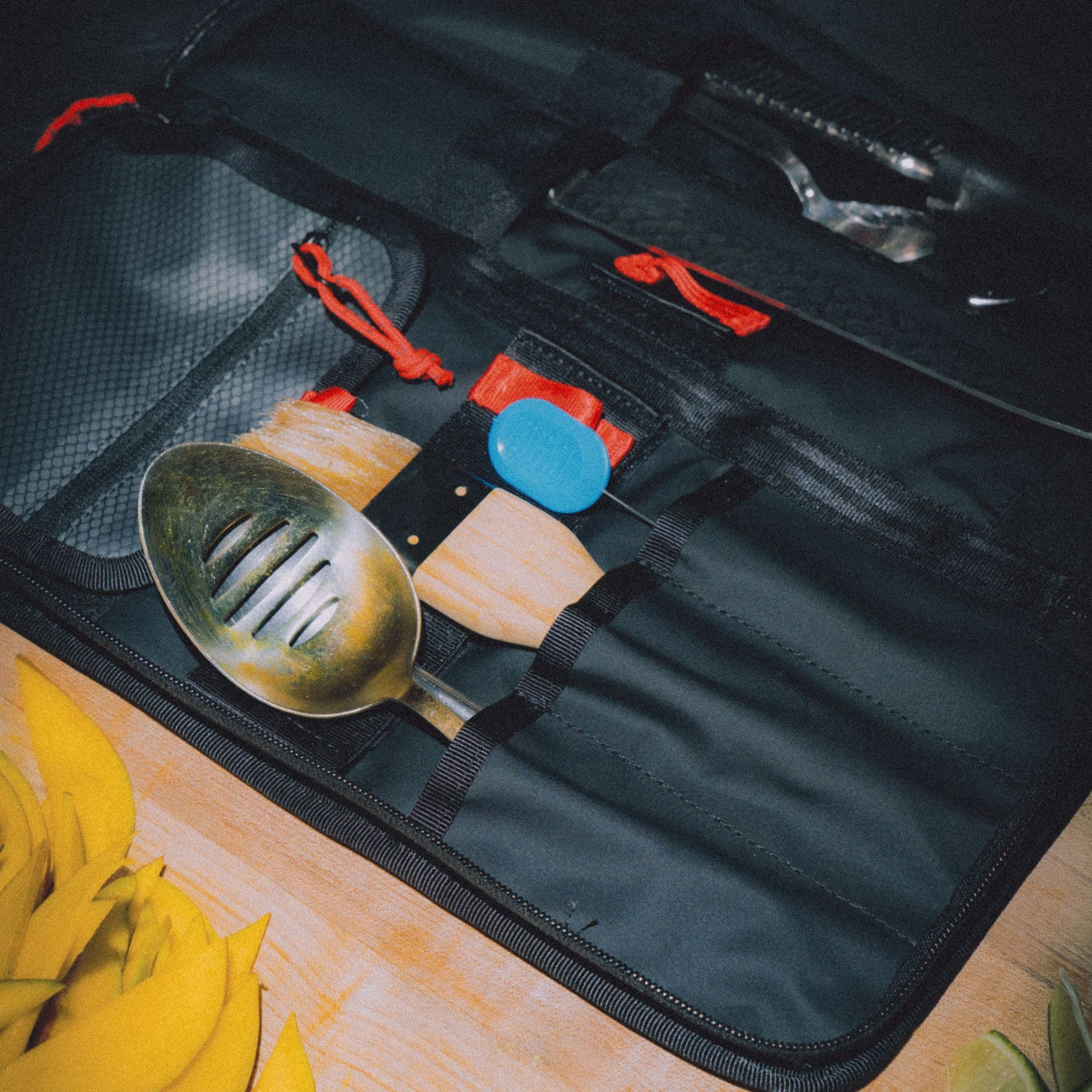 The Knife/tool roll with tools in it up close
