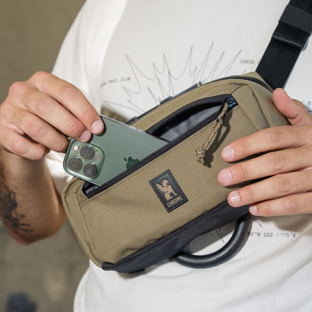 The new Micro Kadet in Coyote brown having a phone put into the front pocket