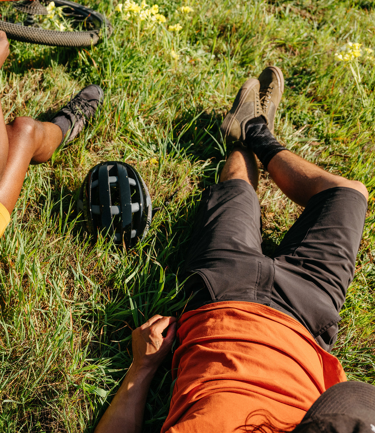 Men's Sutro Short worn by a guy laying in the grass mobile image size