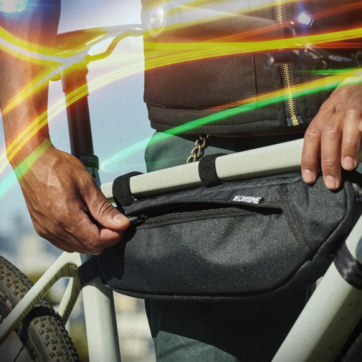 The Holman frame bag on a bike with a zipper getting opened