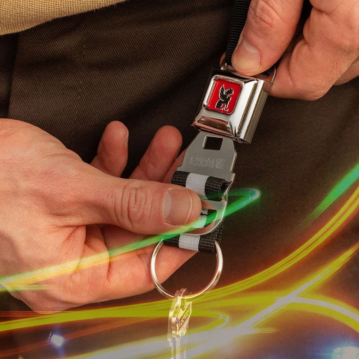 a person working the Mini Buckle Keychain