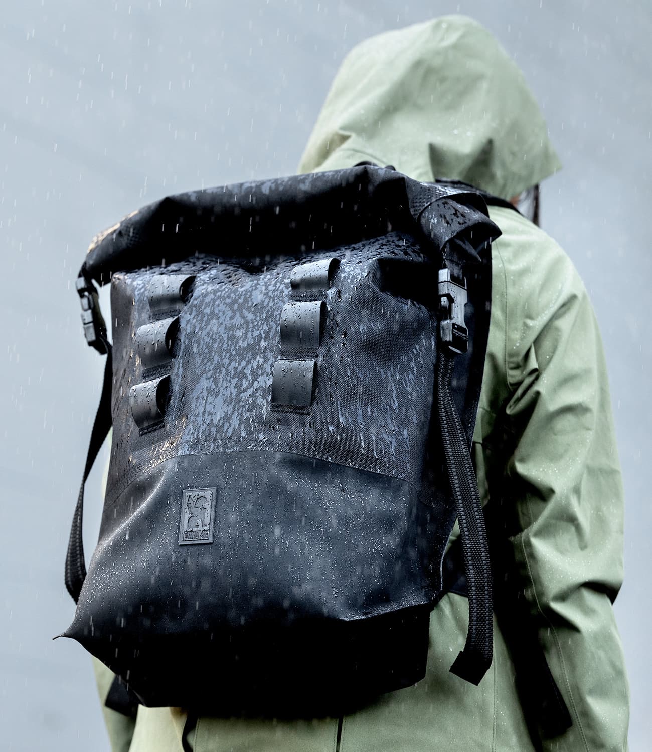 Urban Ex 20L Backpack worn by a person in the rain mobile image size