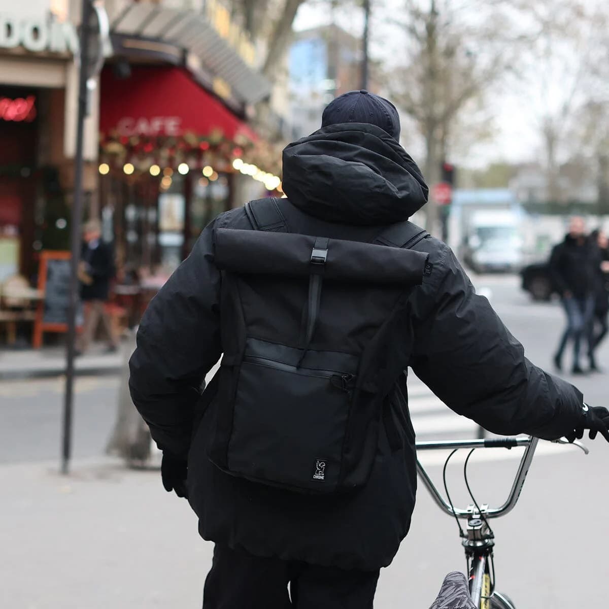Yalta backpack on a person walking a bike