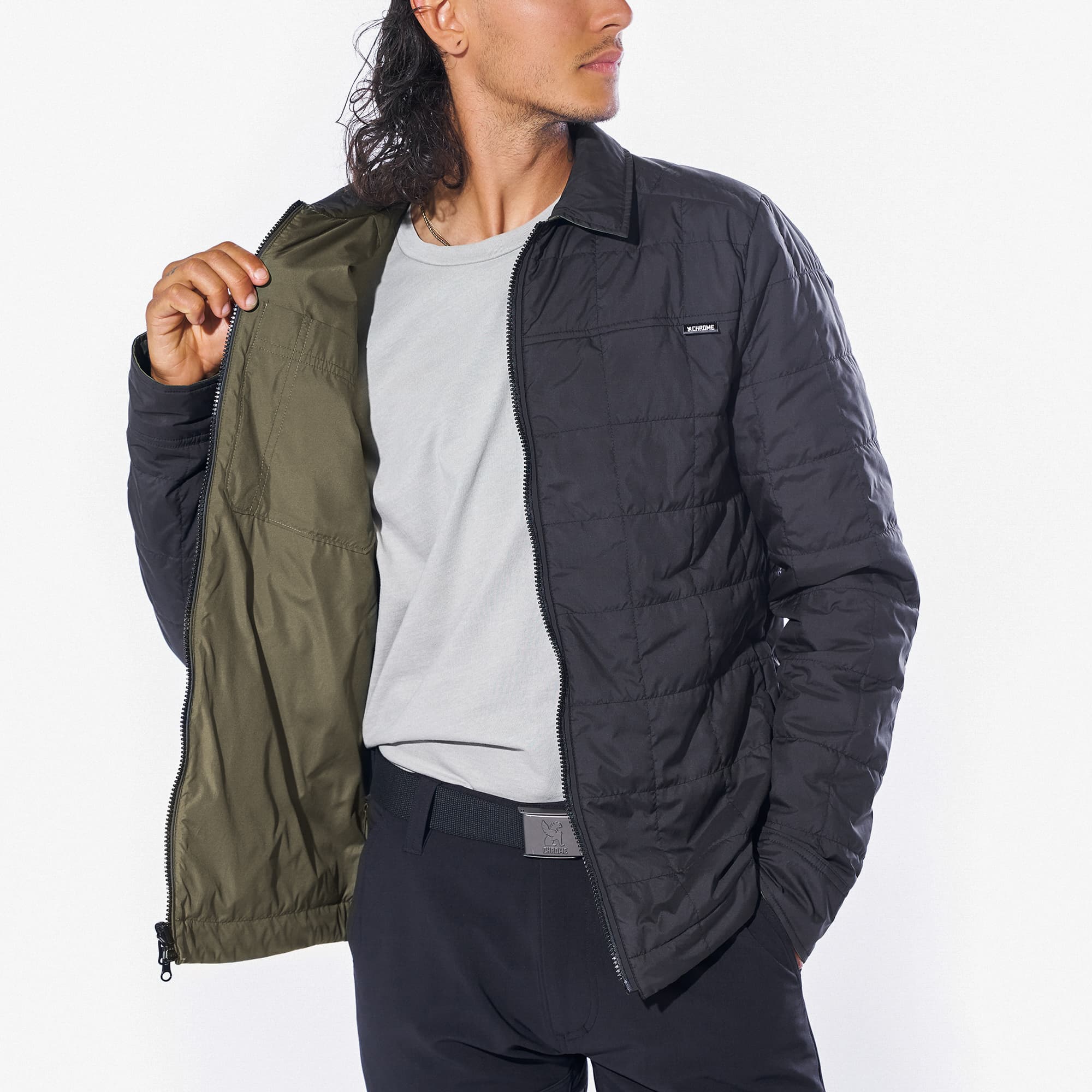 Two way zip Shirt Jacket in black with green on a man holding the side open