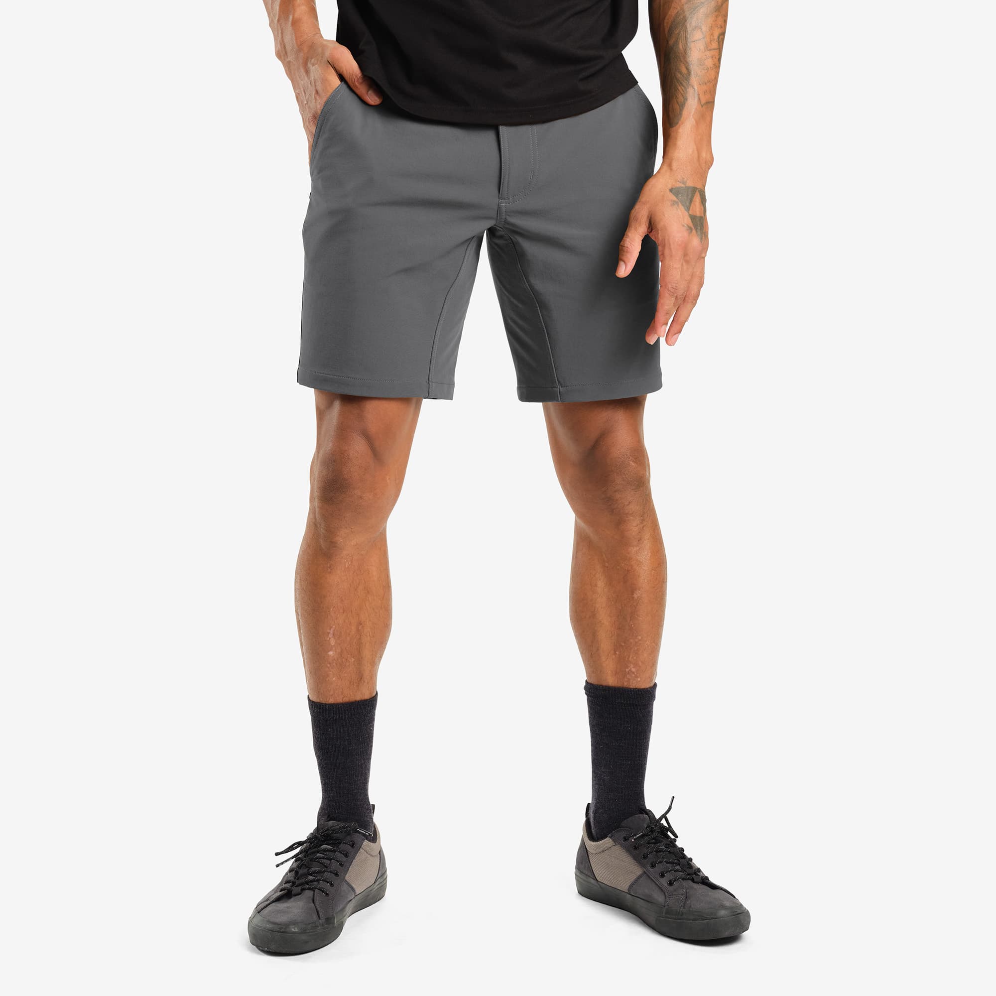 Men's tech Folsom Mid Short in grey worn by a man #color_castle rock