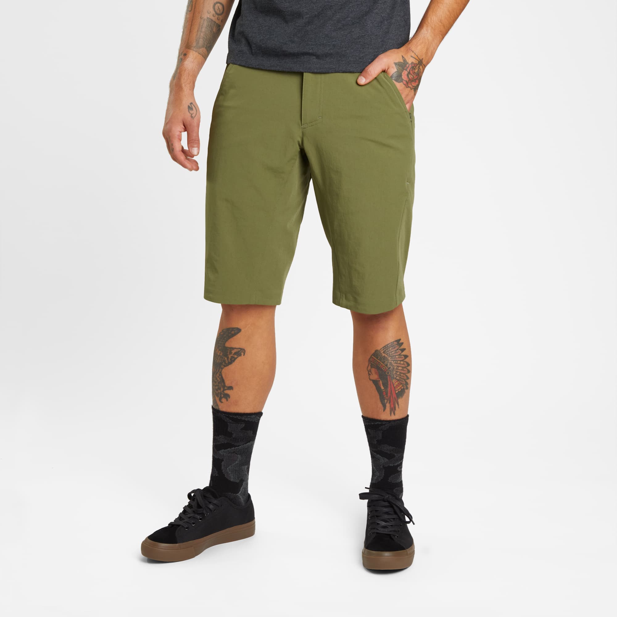 Men's tech Sutro Short in green worn by a man #color_olive branch