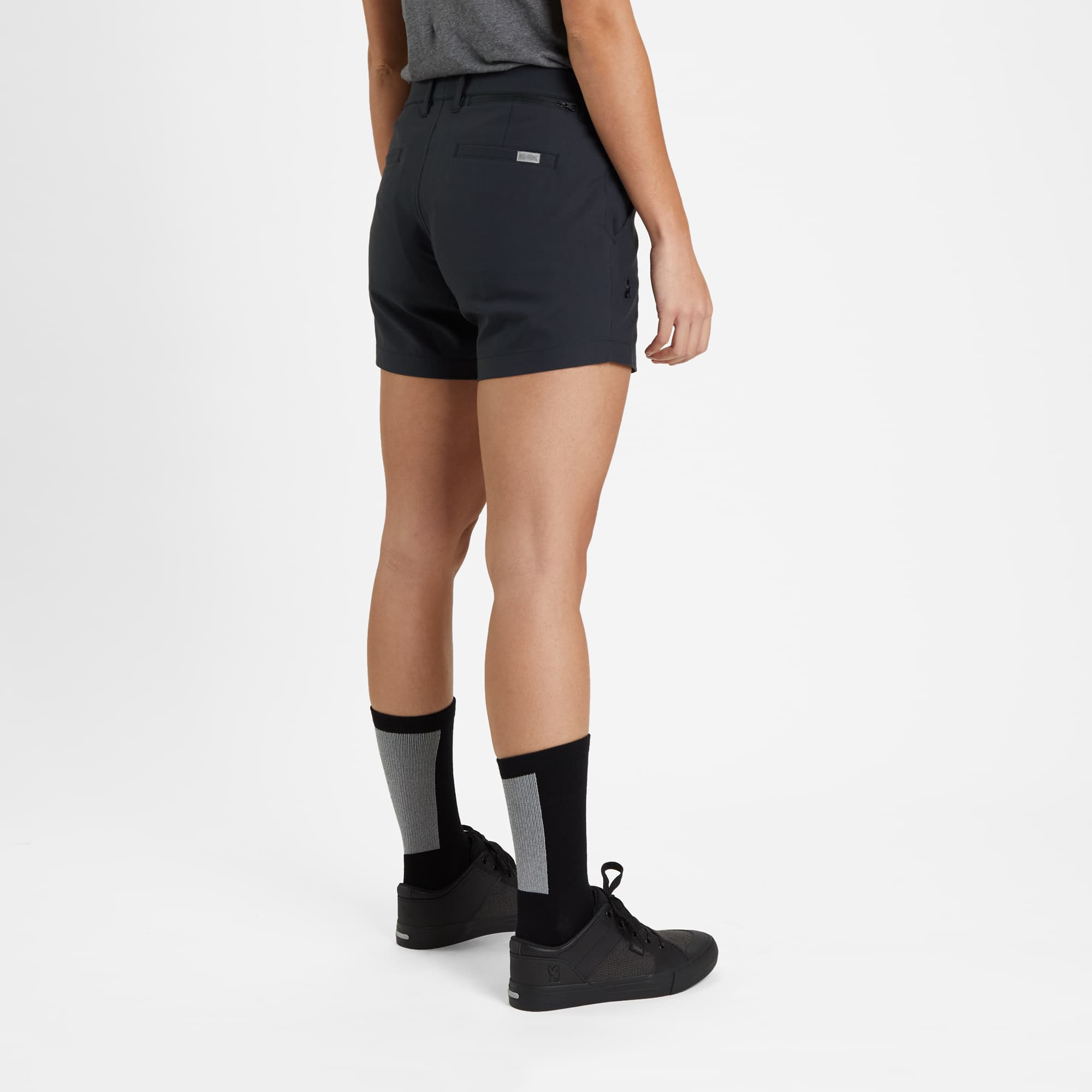 Women's Seneca Short in black worn by a woman right side view #color_black
