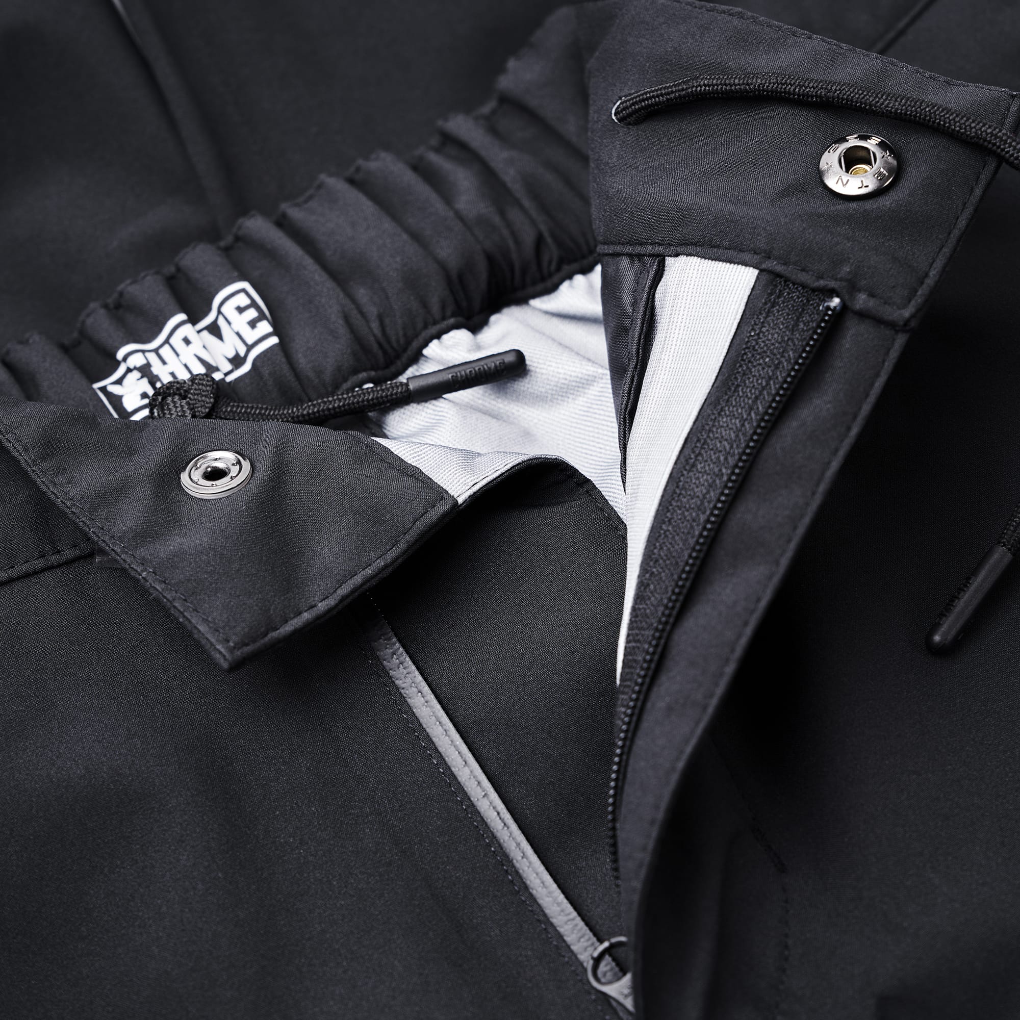 Waterproof rain pant in black zipper & snap detail