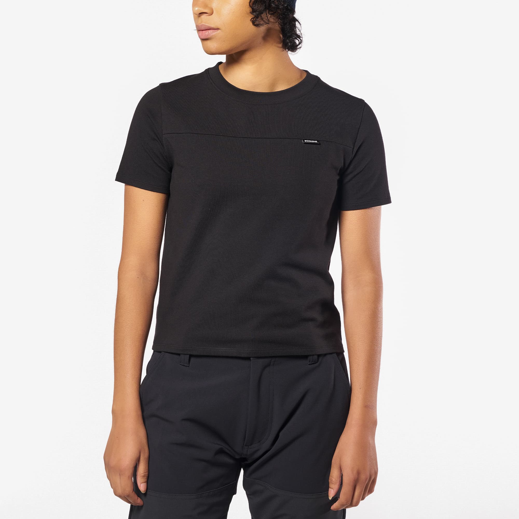 Woman's Holman performance Tee in black worn by a woman