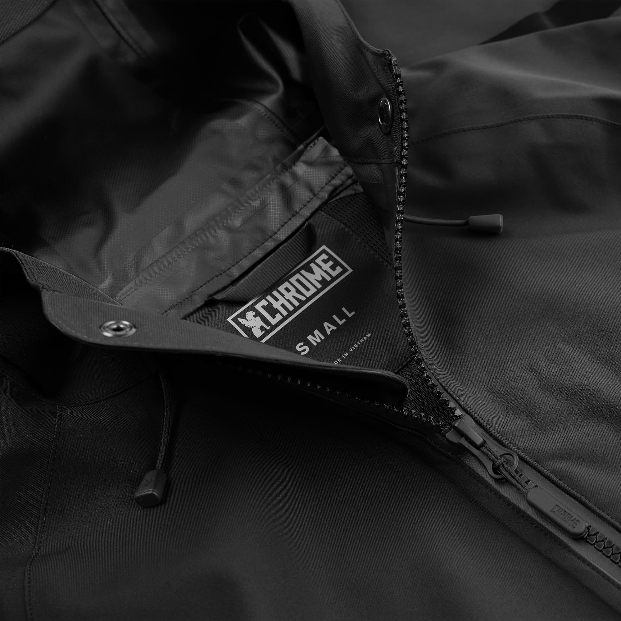 Women's waterproof jacket in black up close zipper