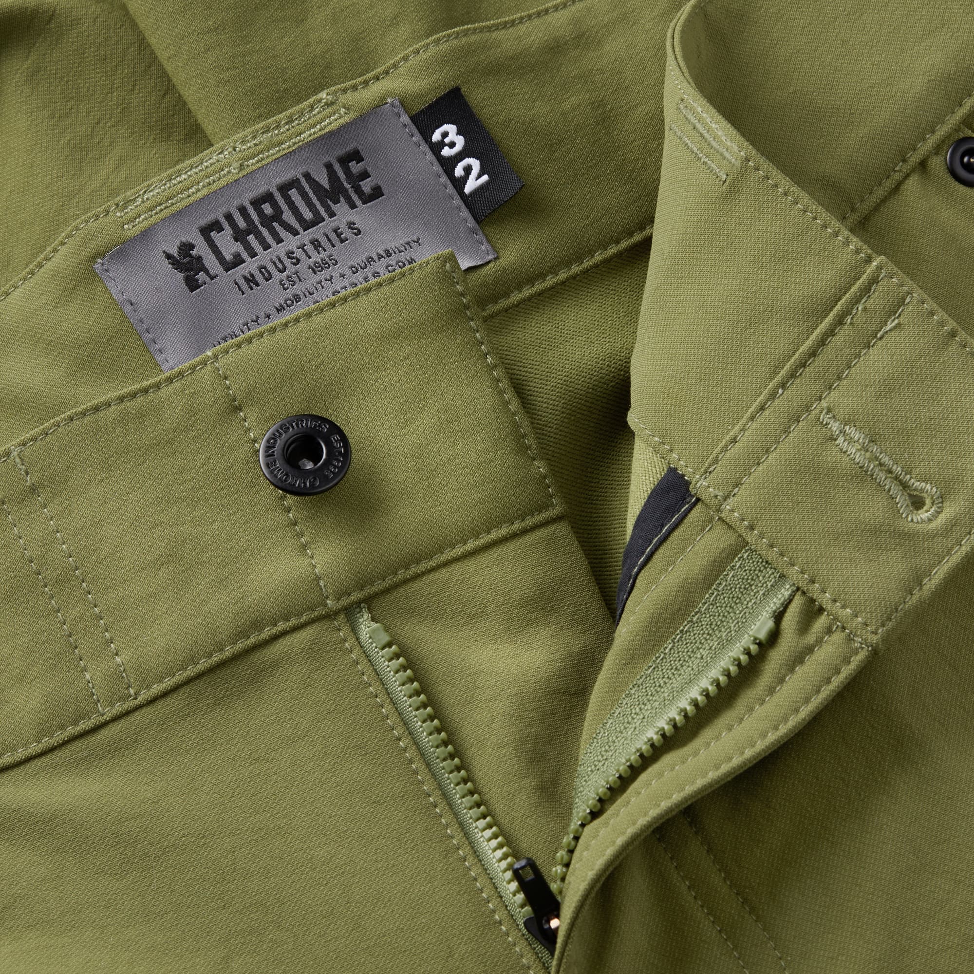 Men's tech Folsom Mid Short in green button & zipper detail #color_olive branch