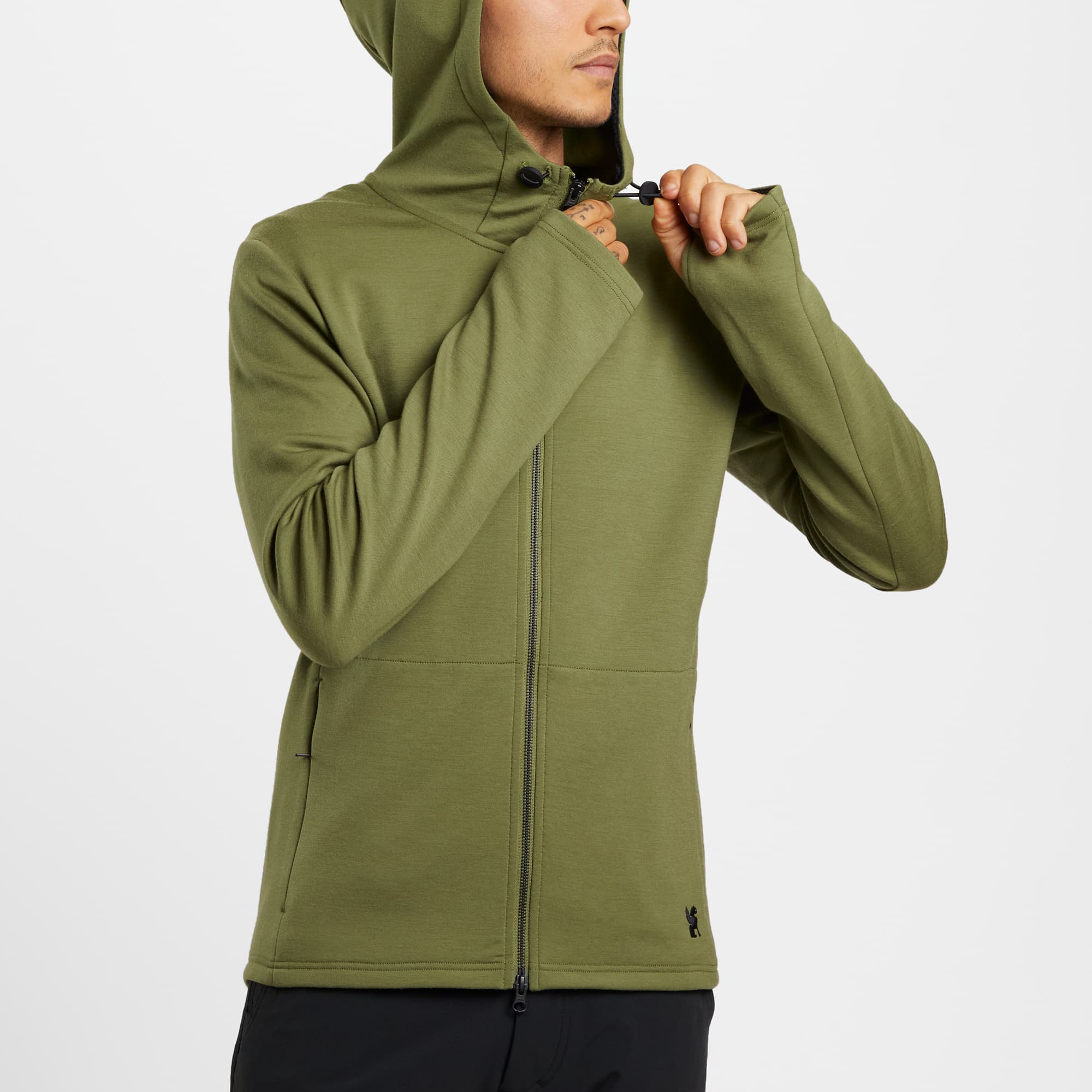 Men's merino blend hoodie in green worn by a man hood toggle detail #color_olive branch