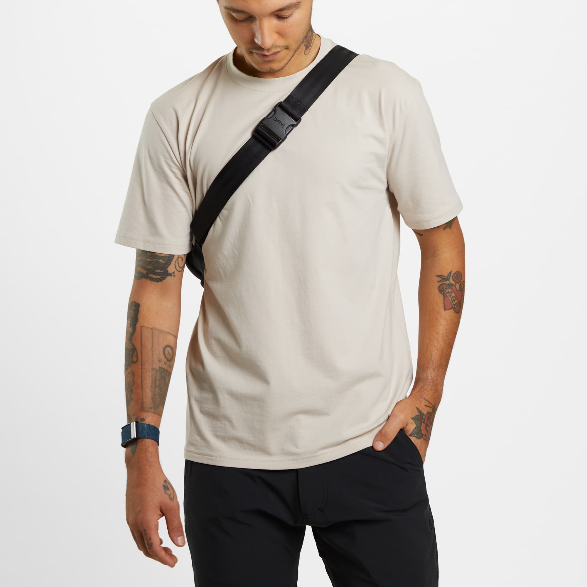 Medium size frame bag worn as a sling on a man front view 
